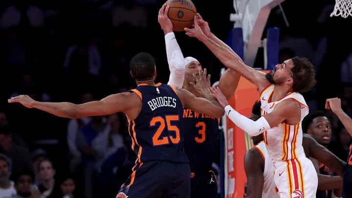 Josh Hart #3 of the New York Knicks tries to pass as Trae Young #11 of the Atlanta Hawks defends during the second half of the quarterfinal game of the Emirates NBA Cup at Madison Square Garden on December 11, 2024 in New York City. The Atlanta Hawks defeated the New York Knicks 108-100 to advance to the semifinal round.