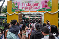 The UST Paskuhan Pop Up Village welcoming students to the bazaar.