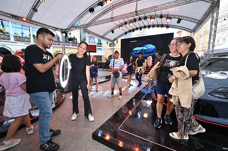 Guests enjoy a wide range of activities, including taking photos with their favorite units during the company’s 55th anniversary celebration recently.