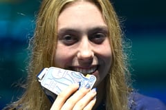 AMERICAN EXPRESS: Walsh leads U.S. dominance in world swim meet
