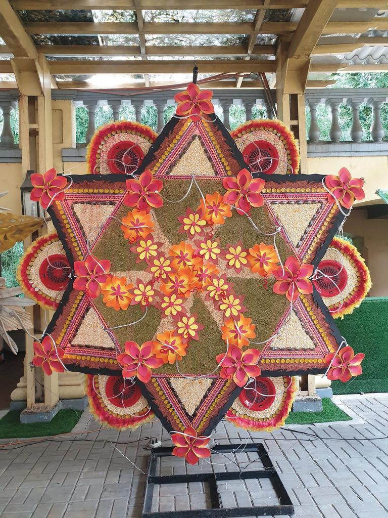 PAROL MAKING CONTEST GRAND
PRIZE. Luzviminda Gallardo’s parol, made
from recycled materials, is beautifully
crafted and symbolizes care for the environment. It creates colorful
decorations while promoting creativity
and responsible material use.