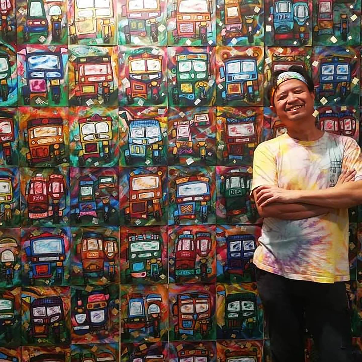 Leonardo Cariño, cultural development officer and artistic director of Ramon Magsaysay Memorial Colleges Teatro Ambahanon poses with his artwork.