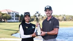 Patty Tavatanakit of Thailand and Jake Knapp of the United States pose with the trophy after winning the Grant Thornton Invitational pairs event featuring LPGA and PGA players