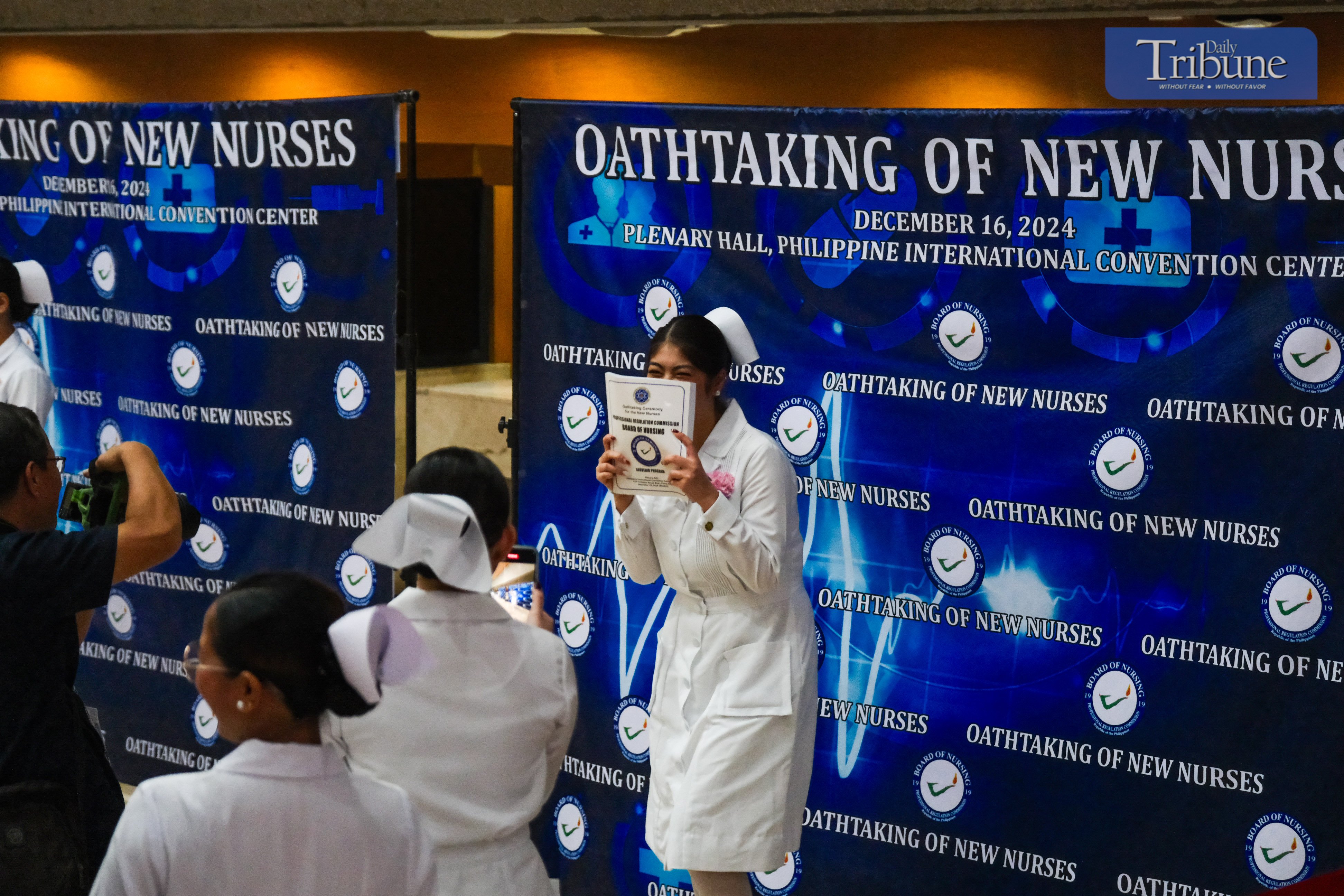 Newly registered nurses line up as they enter the venue for their oath-taking ceremony on 16 December, 2024, at the Plenary Hall of the Philippine International Convention Center (PICC), CCP Complex, Roxas Boulevard, Pasay City. The Professional Regulation Commission (PRC) announced on 28 November that 29,349 out of 34,534 examinees passed the November 2024 Philippine Nurses Licensure Examination.