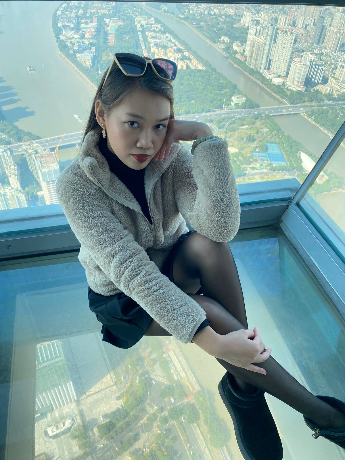 Conquer your fear of heights with Guangzhou above the glass walk at Canton Tower.