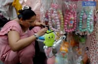 Counterfeit Labubu toys and apparel are seen being sold on a street in Divisoria, Manila, on 17 December 2024. Last November, its toy distributor, POP Mart, issued a statement that they are actively pursuing legal action against the infringement and unauthorized usage of their toys, such as Labubu, in the local market.