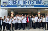 Port of Limay, Bataan personnel led by district collector Atty. Kriden F. Balgomera, 8th left, pose for a photo in of their office after news broke out that they were issued the prestigious ISO.