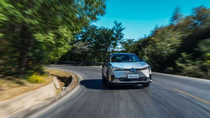 The GAC Emkoo Hybrid carves through winding roads with precision and elegance.