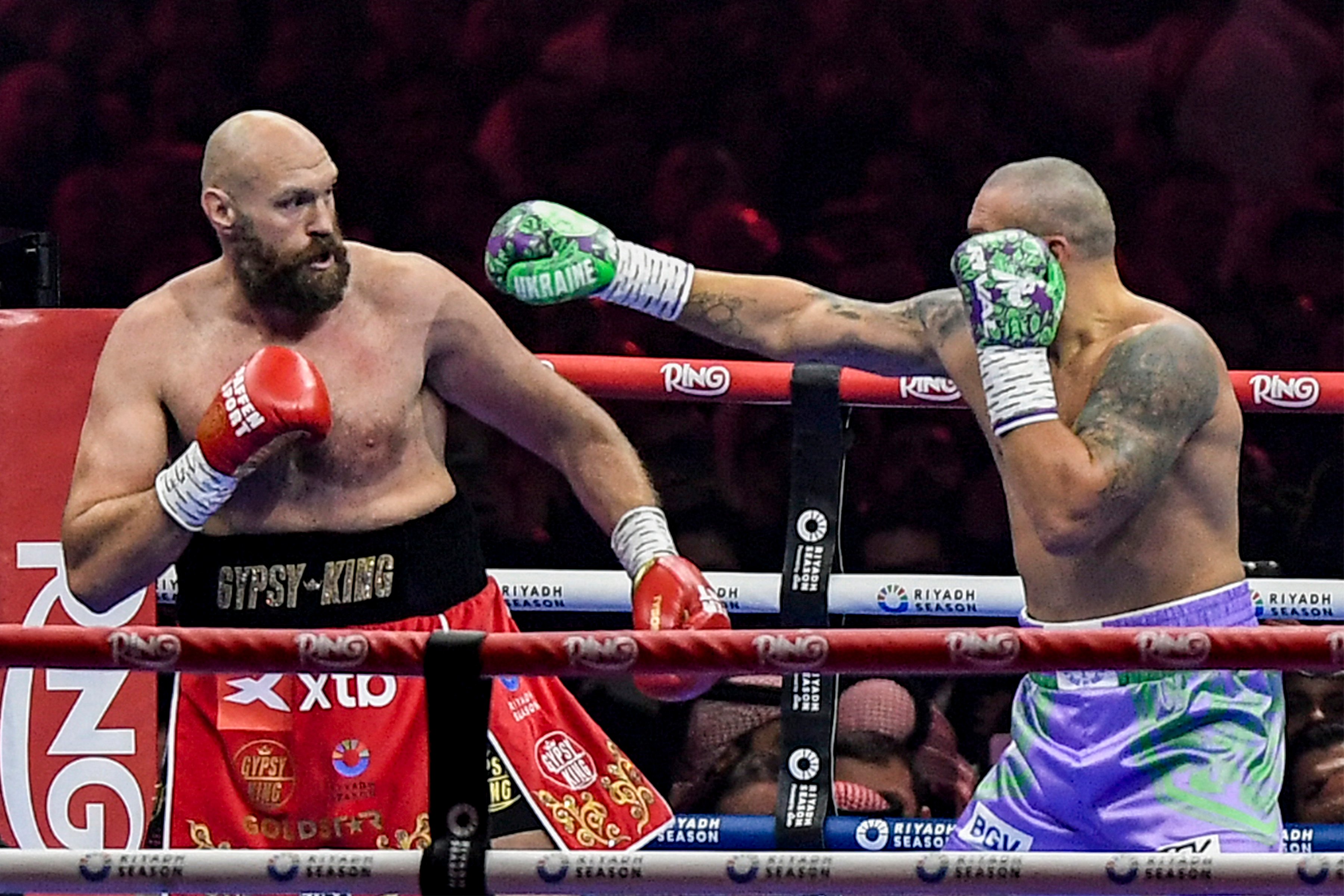Oleksandr Usyk (right) punches his way to a unanimous decision over Tyson Fury in their heavyweight title rematch in Riyadh, Saudi Arabia.
