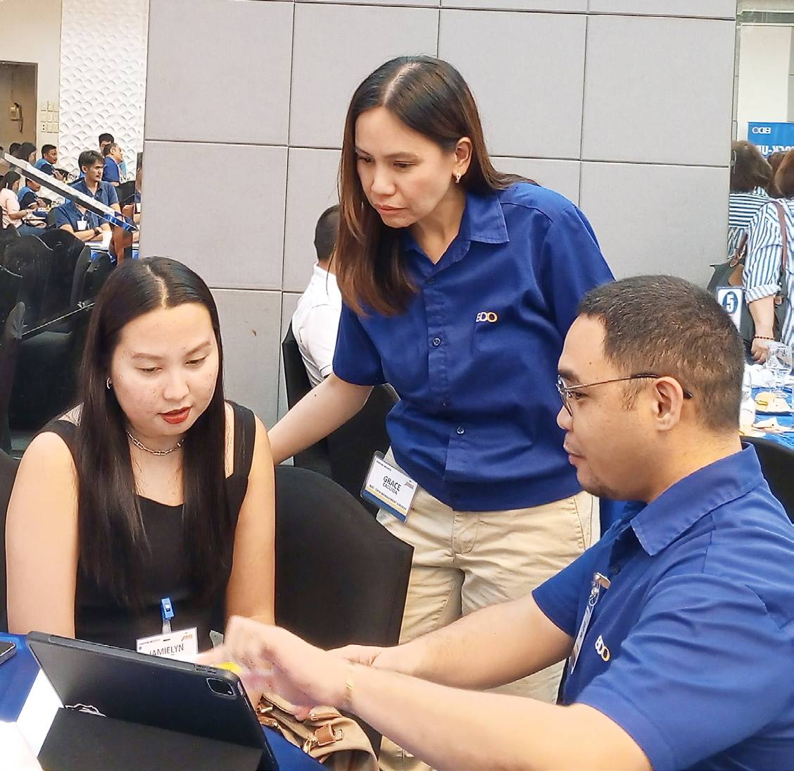 Learning how CMS’ payroll process will help her employees. Jamielyn Tampus (left) listens to Grace R. Caguioa, BDO Unibank First Vice President and Head of its Transaction Banking Group CMS-SME Segment, and Severio Caspe Jr., Business Development Officer, about the features of the various cash management services.