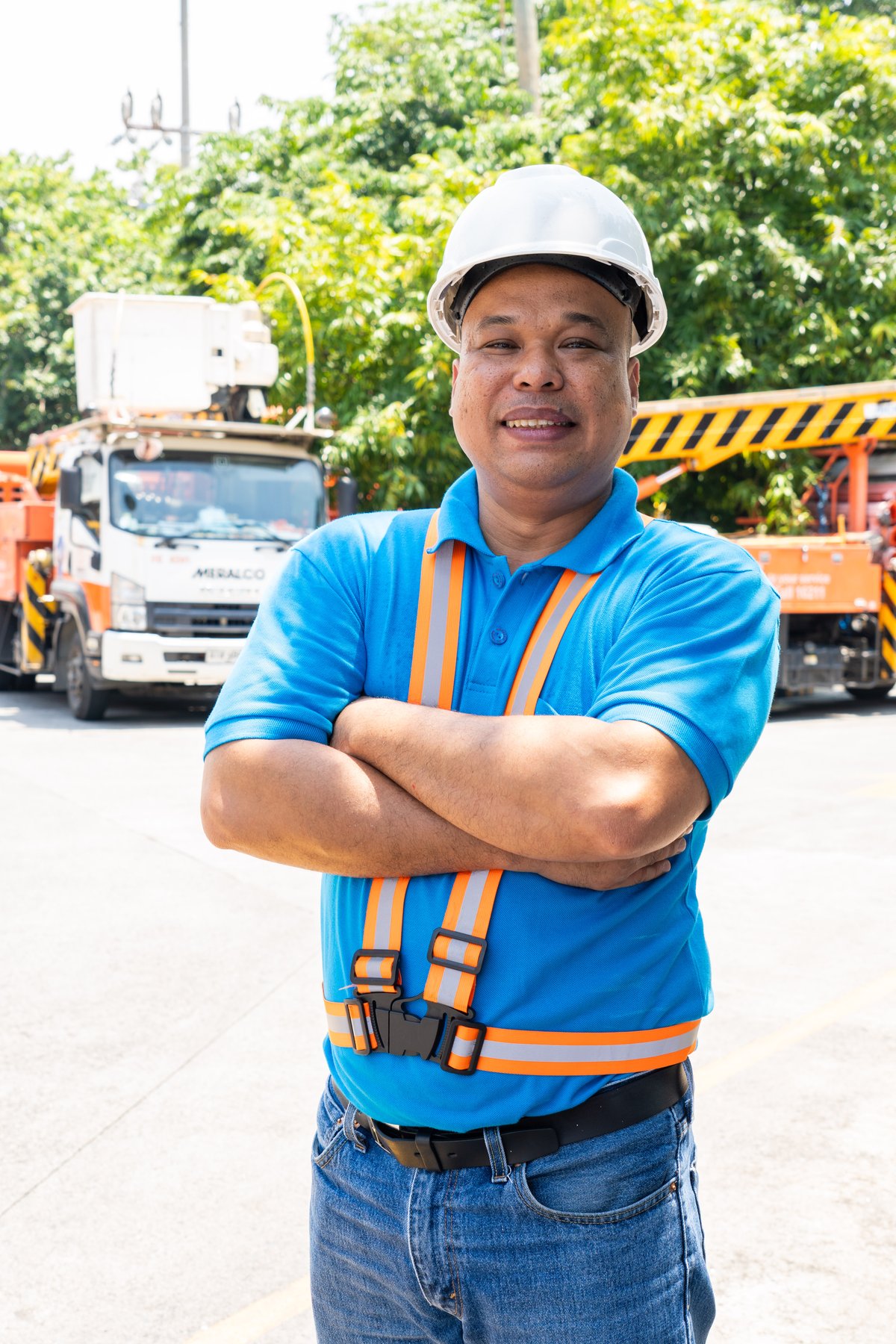 KEEPING THE LIGHTS ON. Ronniel Reyes of Meralco is among the many hardworking and dedicated personnel of the company who are responsible for ensuring a bright Christmas.