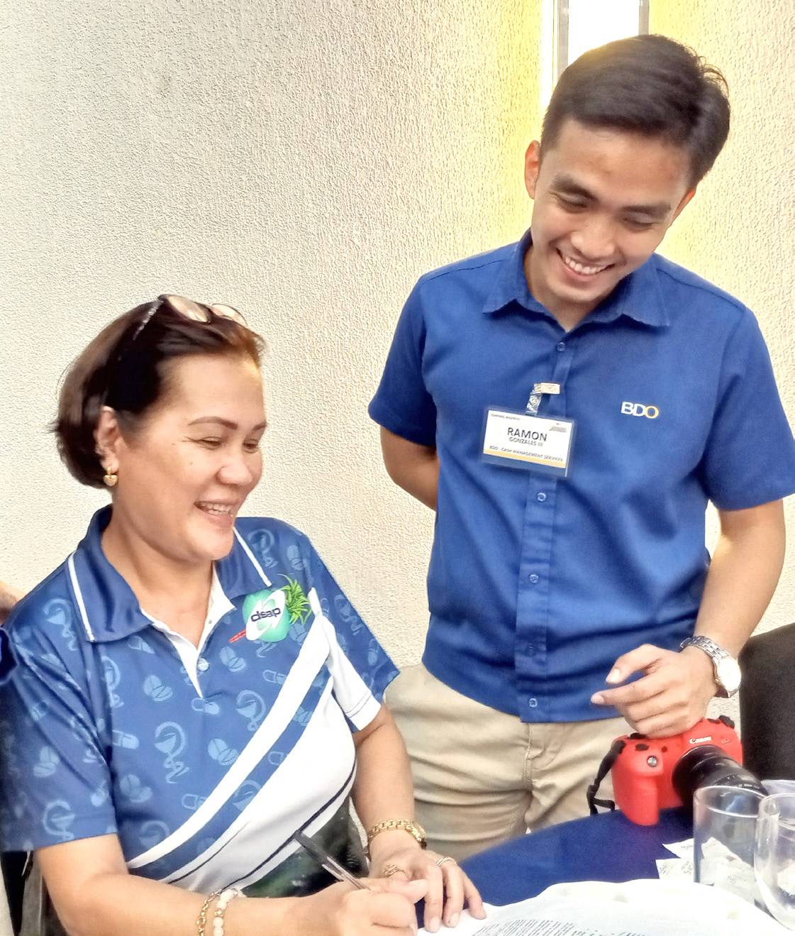 No more tedious manual processing of checks. Anna Liza Santiago (left) shows appreciation on how BDO CMS will improve the check disbursement process of her pharmaceutical business, as explained by Ramon Gonzales III, Business Development Officer of BDO’s CMS-SME.