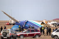 Emergency specialists work at the crash site of an Azerbaijan Airlines passenger jet near the western Kazakh city of Aktau on December 25, 2024.