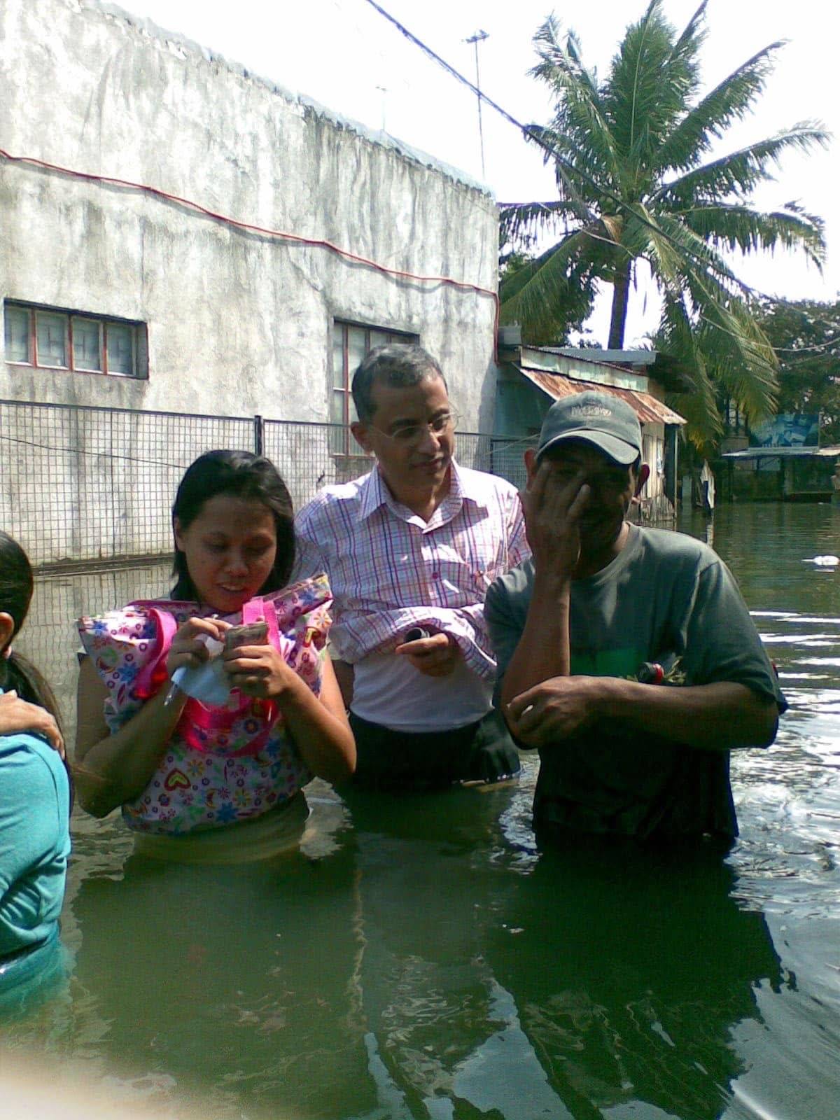 Waist-deep in murky waters at the wake of ‘Ondoy’ in Luzon.