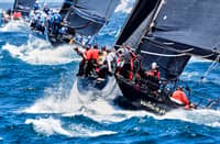 Sailors on board Whisper negotiate the treacherous waters at the start of the Sydney to Hobart race on Thursday at Sydney Harbour.