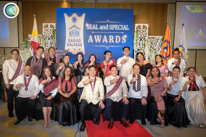 Secretary Robert E.A. Borje, vice chairperson and executive director of CCC (4th from left, seated), with some of the 24th Gawad KALASAG awardees during the national ceremony in Baguio City.