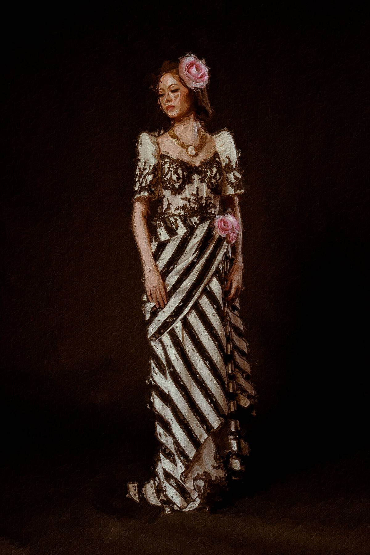 BARO’T SAYA. A modern interpretation done in corseted top with Chantilly lace appliqué and striped saya with inner slip peeping out. Pink handmade flowers hold the tapis. Philippine filigree choker with cameo complete the ensemble.