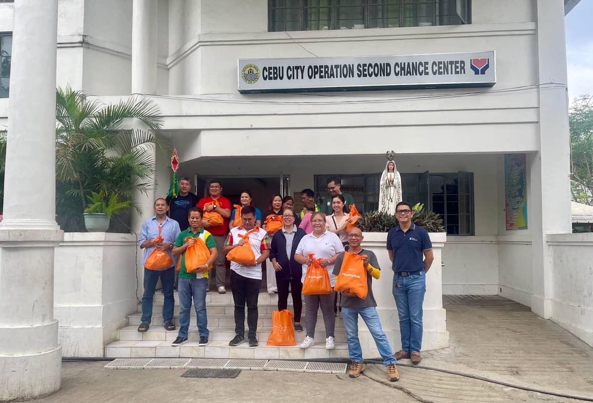 Employee volunteers in Cebu City assisted in packing and distributing food supplies for 220 families at the Cebu City Operation Second Chance Center.