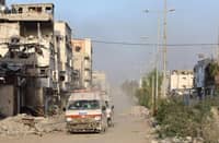 Ambulances transport wounded Palestinians from Kamal Adwan Hospital to Al-Shifa hospital in Gaza City