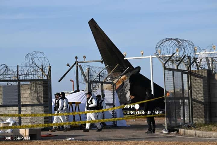Recovery teams work at the scene where a Jeju Air Boeing 737-800 series aircraft crashed and burst into flames at Muan International Airport in Muan, some 288 kilometres southwest of Seoul on December 30, 2024. The Boeing 737-800 was carrying 181 people from Thailand to South Korea when it crashed on arrival on December 29, killing everyone aboard -- save two flight attendants pulled from the twisted wreckage of the worst aviation disaster on South Korean soil.