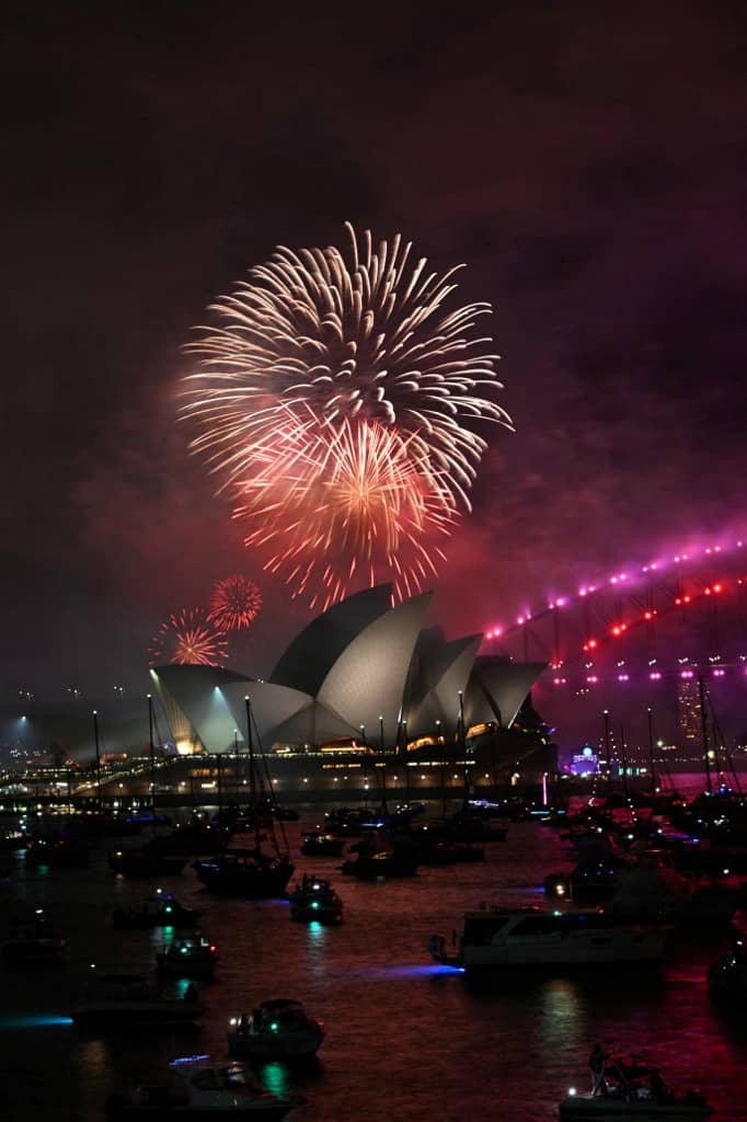 The "family fireworks" light up the Opera House and the Sydney Harbour Bridge, three hours ahead of the main show at midnight in Sydney on New Year's Eve on 31 December, 2024.