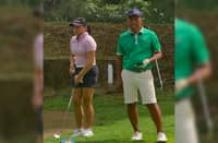 Rianne Malixi is shown with former Philippine Open champion Elmer Salvador during a practice round at the Apo Golf and Country Club in Davao City.
