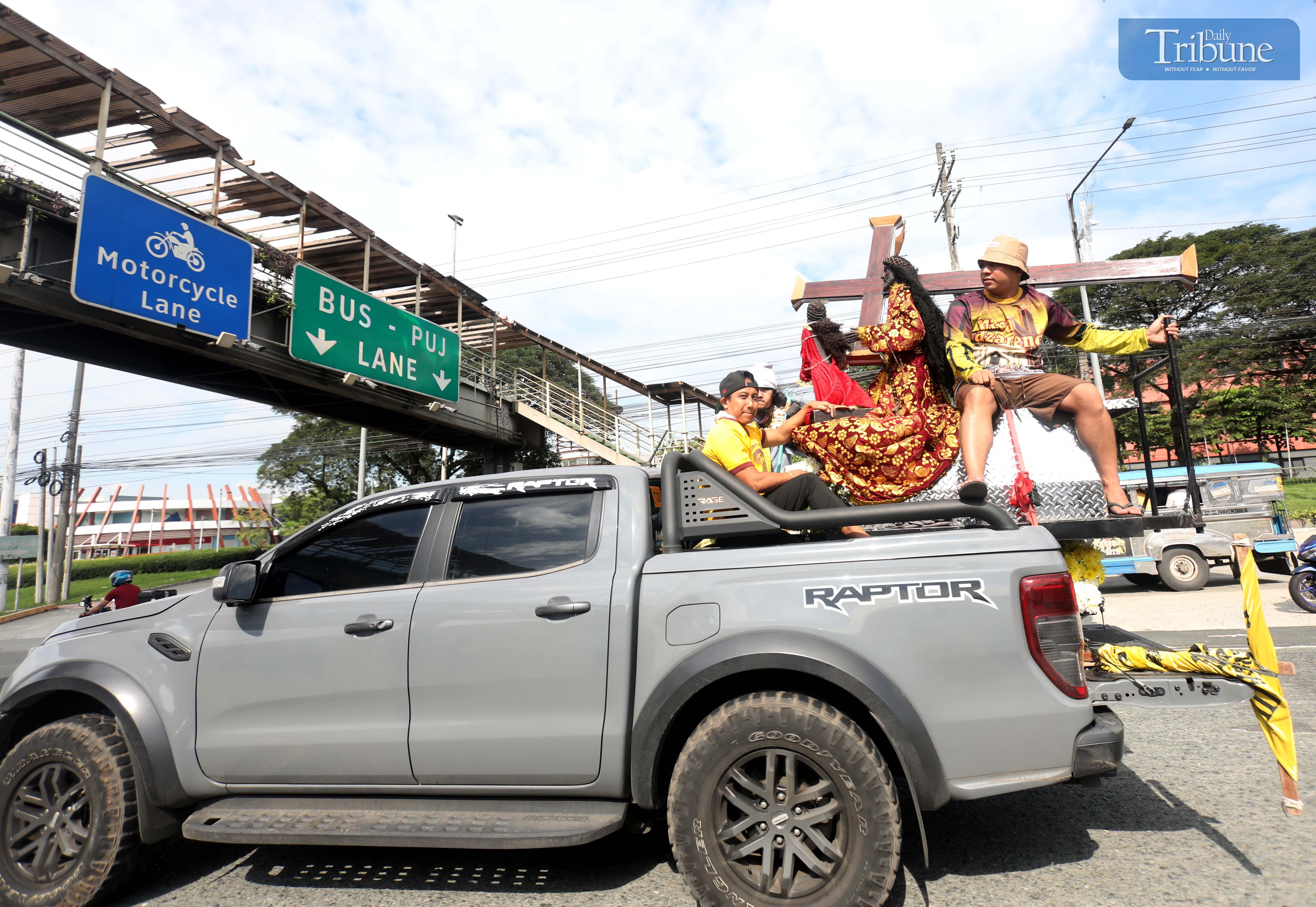 Devotee prepares Black Nazarene replica for blessing