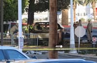Investigators photograph a Tesla Cybertruck that exploded outside the lobby of President-elect Donald Trump's hotel on January 1, 2025, in Las Vegas. At least one person was killed and seven wounded when a Tesla Cybertruck exploded outside a hotel belonging to US President-elect Donald Trump in Las Vegas, police said Wednesday.