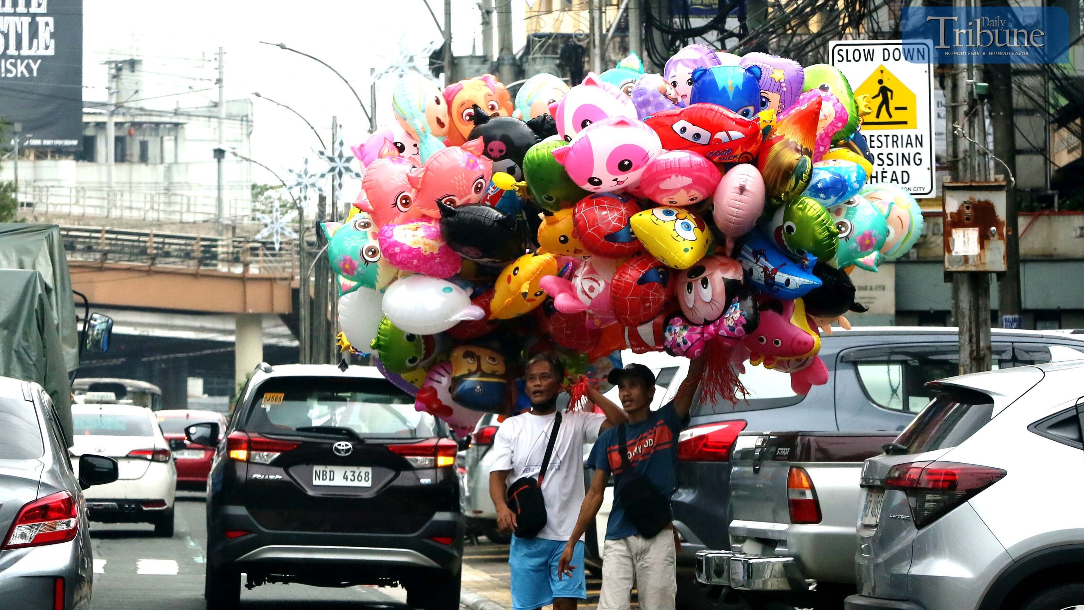 Colorful balloons brighten Timog Avenue