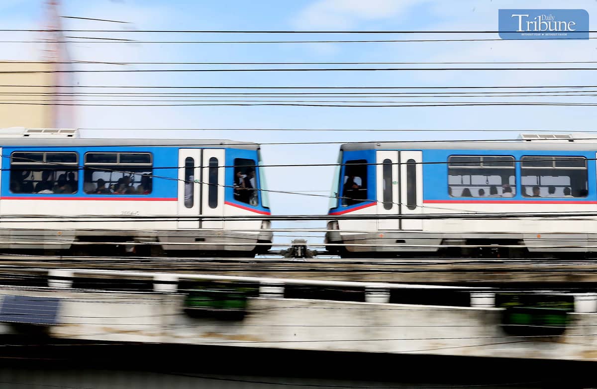 An MRT-3 train is seen passing through Kamuning, Quezon City, on Saturday, 4 January 2025.