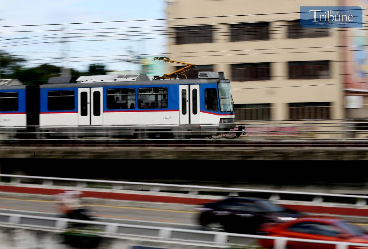 An MRT-3 train is seen passing through Kamuning, Quezon City, on Saturday, 4 January 2025.