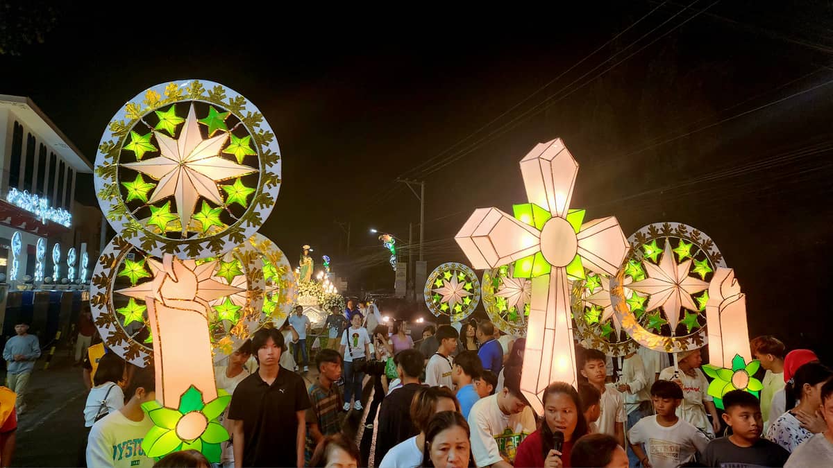 Bright lanterns of barangay of Santa Ines illumine the maitinis procsession.