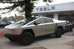 US stocks rise, Tesla surges 11.9%