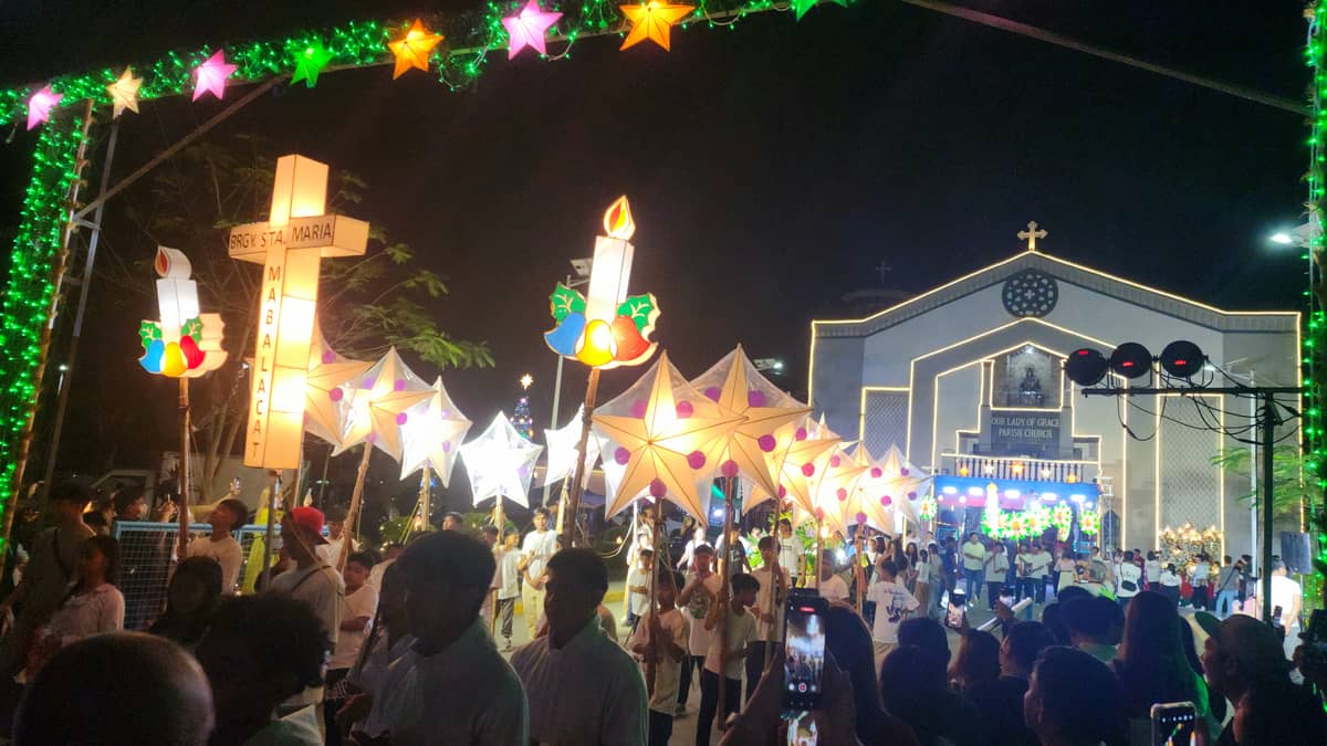 Participants from different chapels in Mabalacat trooped out of the Our Lady of Grace Parish Church for the maitinis procession.