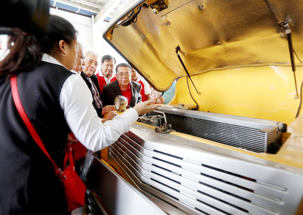 Luis ‘Chavit’ Singson looks on as partners explain what’s under the hood.