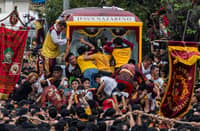 SACRIFICE AND FAITH: Catholics brave crowds and heat every 9 January to be near the image of the Black Nazarene during the Traslacion procession.