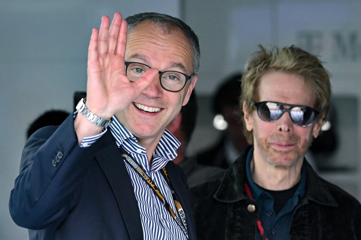FORMULA 1 CEO Stefano Domenicali and producer Jerry Bruckheimer share a moment at the Belgian Grand Prix. The Belgian F1 secures a deal that opens the door for new races.