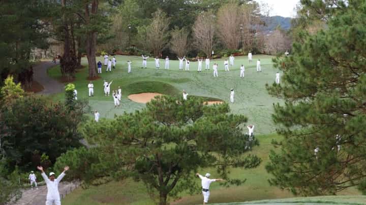 Caddies at Camp John Hay Golf Club wait for the ceremonial tee marking a new beginning under the Bases Conversion and Development Authority through the consortium of Golfplus Management and DuckWorld PH.
