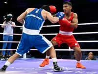 Olympic bronze medalist Eumir Marcial (right) faces a tough battle outside the ring.