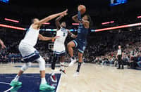 Ja Morant #12 of the Memphis Grizzlies shoots the ball during the game against the Minnesota Timberwolves on January 11, 2025 at Target Center in Minneapolis, Minnesota. NOTE TO USER: User expressly acknowledges and agrees that, by downloading and or using this Photograph, user is consenting to the terms and conditions of the Getty Images License Agreement. Mandatory Copyright Notice: Copyright 2025 NBAE Jordan Johnson/NBAE via Getty Images/AFP
Jordan Johnson / NBAE / Getty Images / Getty Images via AFP