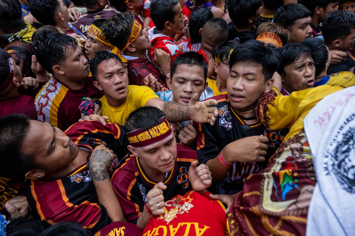 Devotees, mostly men, jostled each other to get near the andas.