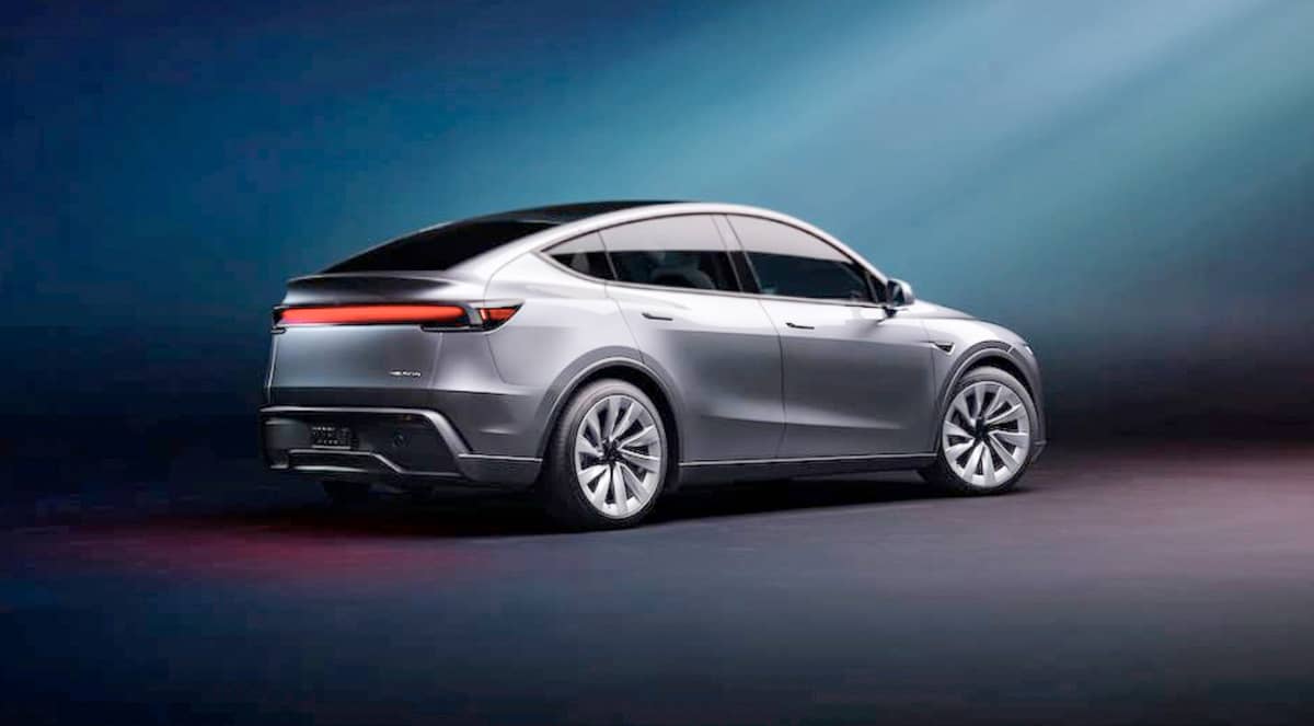 REAR view of the New Model Y highlights its futuristic taillight and aerodynamic design, blending style and functionality seamlessly.