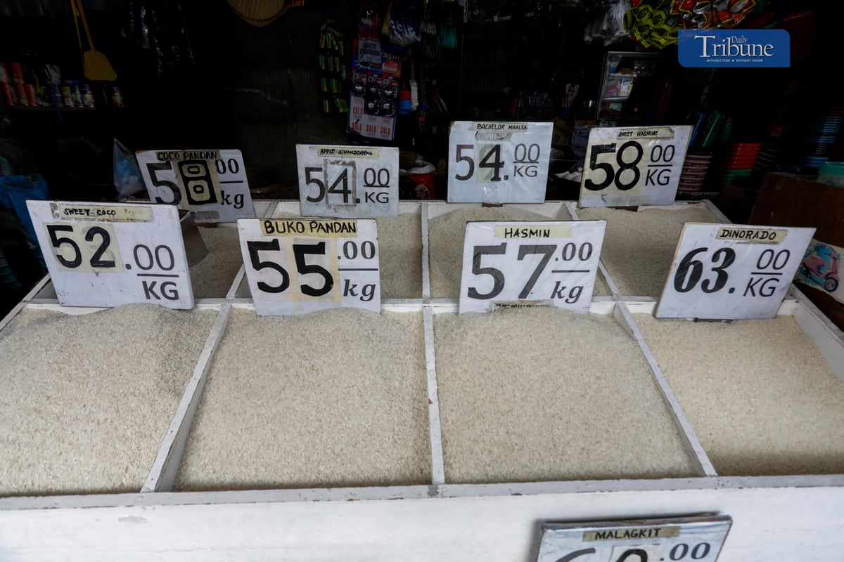 A merchant sells rice in a store at Arayat Market, Quezon City. Prices of rice are still on stand by according to a rice seller.