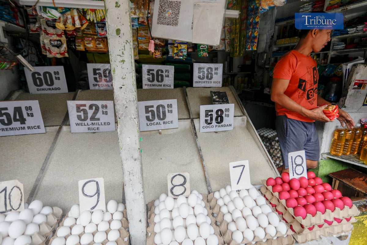 A merchant sells rice in a store at Arayat Market, Quezon City. Prices of rice are still on stand by according to a rice seller.