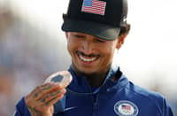 Nyjah Huston holds his bronze medal after the victory ceremony for the men's street skateboarding event on July 29, 2024.