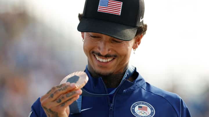 Nyjah Huston holds his bronze medal after the victory ceremony for the men's street skateboarding event on July 29, 2024.