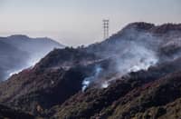 Wildfire smoke and hotspots from the Palisades fire area seen from Encino Hill on 12 January 2025 in Encino neighborhood of Los Angeles, California. Multiple wildfires fueled by intense Santa Ana Winds are still burning across Los Angeles County while some containment has been achieved. At least 16 people have died and over 100,000 people are still under evacuation orders. Over 12,000 structures have been destroyed in the fires.