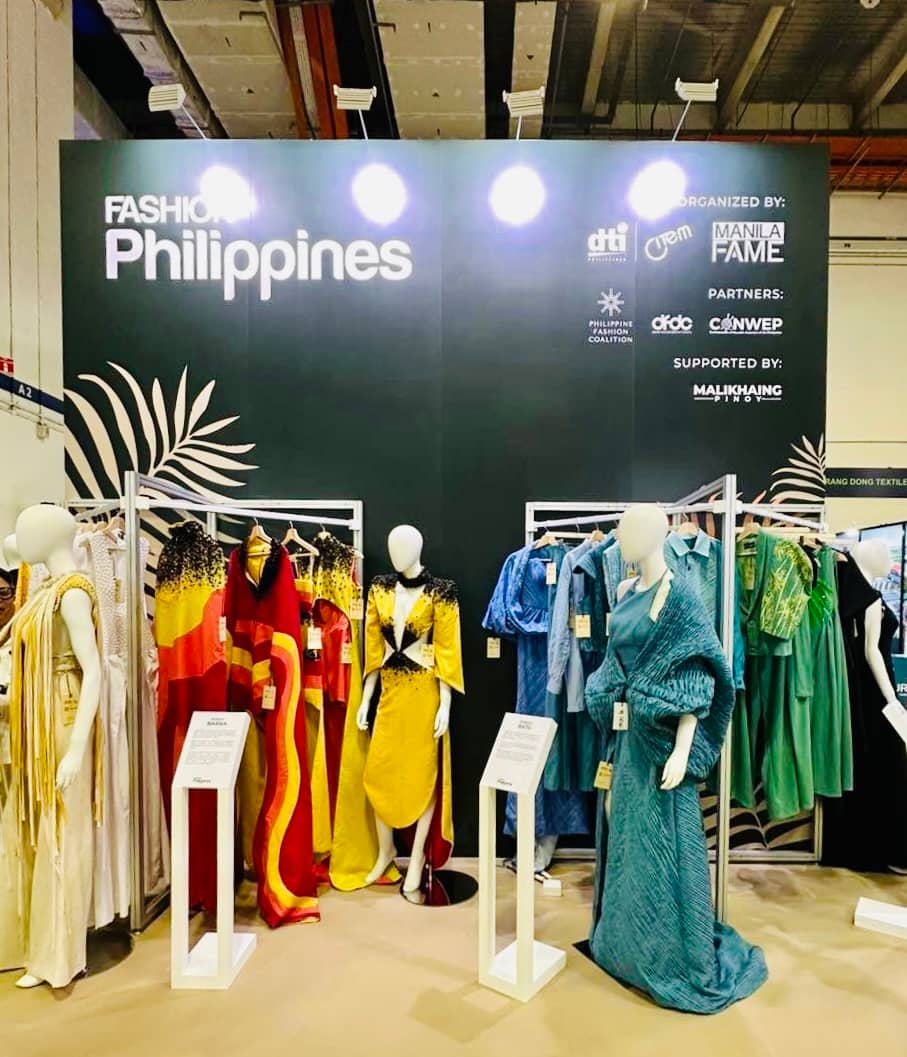 Yellow and red dresses by Popoy Barba and to the right the blue ensembles by Dodjie Batu.