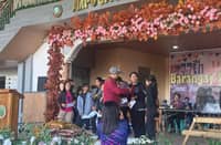 Students from Barangay Ampucao receive reward money for their academic excellence courtesy of Philex Mining Corp.