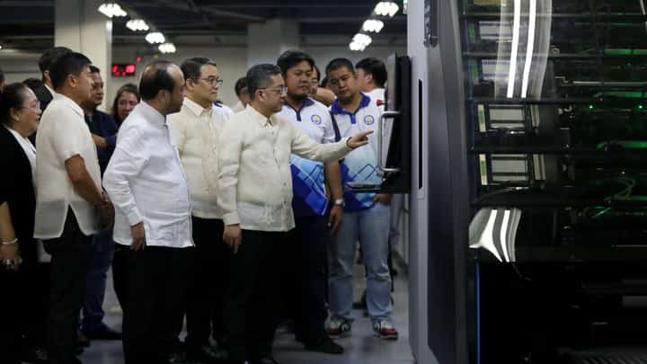 Comelec Chairman George Erwin Garcia shows ballots to the media on Monday, 6 January 2025, at the national printing office in Quezon City.